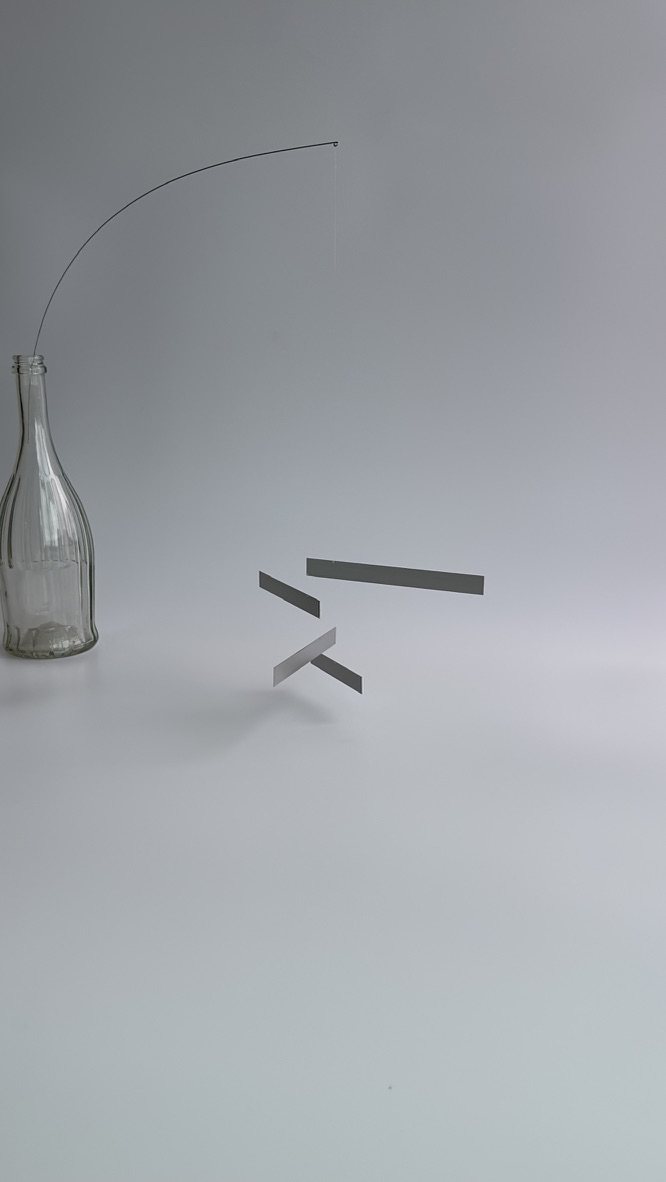 MOBILE 01 — the pieces turning in the air